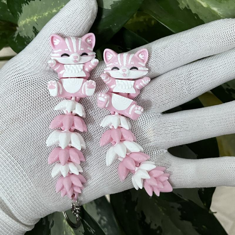 3D プリントされたピンクの猫のキーホルダー、関節式の柔軟な - 3D Printing Design Software のレビューと価格