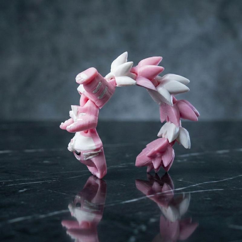 3D プリントされたピンクの猫のキーホルダー、関節式の柔軟な - 3D Printing Design Software のレビューと価格