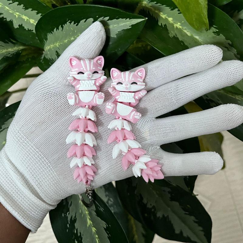 3D プリントされたピンクの猫のキーホルダー、関節式の柔軟な - 3D Printing Design Software のレビューと価格